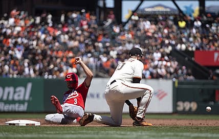 Jun 26, 2022; San Francisco, California, USA; Cincinnati Reds right fielder Albert Almora Jr. (3) slides safely into third base ahead of the relay to San Francisco Giants third baseman Evan Longoria (10) during the third inning at Oracle Park. Mandatory Credit: D. Ross Cameron-USA TODAY Sports
