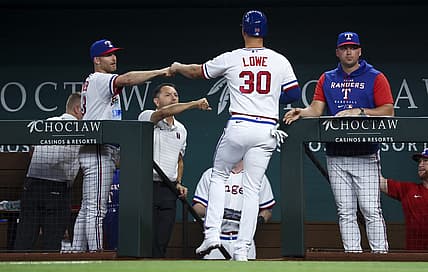 Aug 13, 2022; Arlington, Texas, USA;  Texas Rangers first baseman Nathaniel Lowe (30) celebrates with teammates after scoring during the fourth inning against the Seattle Mariners at Globe Life Field. Mandatory Credit: Kevin Jairaj-USA TODAY Sports