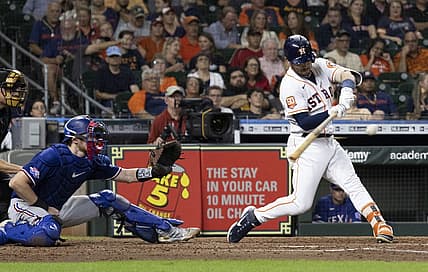 Sep 6, 2022; Houston, Texas, USA; Houston Astros third baseman Alex Bregman (2) hits a single against the Texas Rangers in the fifth inning at Minute Maid Park. Mandatory Credit: Thomas Shea-USA TODAY Sports