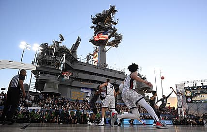 Nov 11, 2022; San Diego, California, US; Gonzaga Bulldogs guard Nolan Hickman (11) shoots the ball over Michigan State Spartans guard Trejuan Holloman (5) during the first half at USS Abraham Lincoln. Mandatory Credit: Orlando Ramirez-USA TODAY Sports