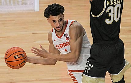Dec 2, 2022; Clemson, SC, USA;  Clemson junior guard Chase Hunter (1) passes around Wake Forest guard Damari Monsanto (30) during the second half at Littlejohn Coliseum Friday, December 2, 2022. Mandatory Credit: Ken Ruinard/USA TODAY-USA TODAY NETWORK