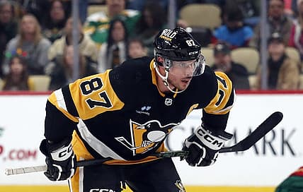 Dec 18, 2023; Pittsburgh, Pennsylvania, USA;  Pittsburgh Penguins center Sidney Crosby (87) prepares to take a face-off against the Minnesota Wild during the third period at PPG Paints Arena. Pittsburgh won 4-3. Mandatory Credit: Charles LeClaire-USA TODAY Sports