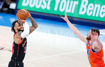 Mar 31, 2021; Oklahoma City, Oklahoma, USA; Toronto Raptors guard Gary Trent Jr. (33) shoots a three point basket as Oklahoma City Thunder guard Svi Mykhailiuk (14) defends the shot during the second half at Chesapeake Energy Arena. Mandatory Credit: Alonzo Adams-USA TODAY Sports