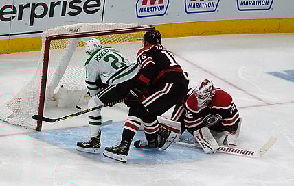 Apr 8, 2021; Chicago, Illinois, USA; Dallas Stars left wing Jason Robertson (21) scores a goal on Chicago Blackhawks goaltender Kevin Lankinen (32) during the second period at United Center. Mandatory Credit: David Banks-USA TODAY Sports