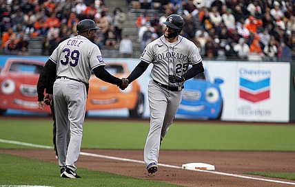 Aug 14, 2021; San Francisco, California, USA; Colorado Rockies first baseman C.J. Cron (25) celebrates with third base coach Stu Cole (39) after hitting a home run against San Francisco Giants starting pitcher Sammy Long (not pictured) during the first inning at Oracle Park. Mandatory Credit: D. Ross Cameron-USA TODAY Sports