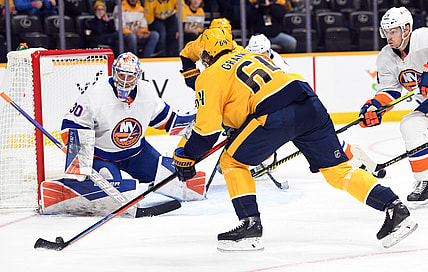 Oct 30, 2021; Nashville, Tennessee, USA; New York Islanders goaltender Ilya Sorokin (30) makes a save on a shot attempt from Nashville Predators center Mikael Granlund (64) during the first period at Bridgestone Arena. Mandatory Credit: Christopher Hanewinckel-USA TODAY Sports