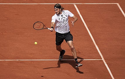 May 30, 2022; Paris, France; Stefanos Tsitsipas (GRE) returns a shot in his match against Holger Rune (DEN) on day nine of the French Open at Stade Roland-Garros. Mandatory Credit: Susan Mullane-USA TODAY Sports