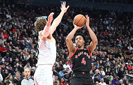 Dec 23, 2023; Toronto, Ontario, CAN;  Toronto Raptors forward Scottie Barnes (4) shoots the ball as Utah Jazz forward Lauri Markkanen (23) defends in the first half at Scotiabank Arena. Mandatory Credit: Dan Hamilton-USA TODAY Sports