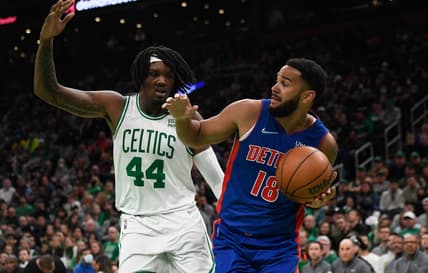 Mar 11, 2022; Boston, Massachusetts, USA;  Detroit Pistons guard Cory Joseph (18) looks to pass the ball while Boston Celtics center Robert Williams III (44) defends during the first half at TD Garden. Mandatory Credit: Bob DeChiara-USA TODAY Sports