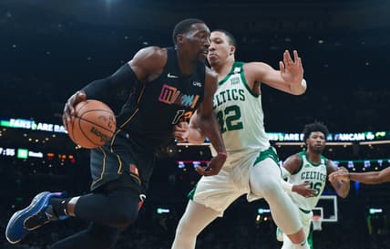 Mar 30, 2022; Boston, Massachusetts, USA; Miami Heat center Bam Adebayo (13) dribbles the ball while Boston Celtics forward Grant Williams (12) defends during the first half at TD Garden. Mandatory Credit: Bob DeChiara-USA TODAY Sports