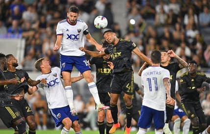 Aug 16, 2022; Los Angeles, California, USA; LAFC defender Eddie Segura (4) defends D.C. United defender Steve Birnbaum (15) on a pass from a free kick in the first half at Banc of California Stadium. Mandatory Credit: Jayne Kamin-Oncea-USA TODAY Sports