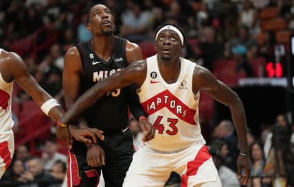 Oct 22, 2022; Miami, Florida, USA; Miami Heat center Bam Adebayo (13) and Toronto Raptors forward Pascal Siakam (43) battle for a rebound in the first half at FTX Arena. Mandatory Credit: Jim Rassol-USA TODAY Sports