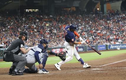 Oct 2, 2022; Houston, Texas, USA;  Houston Astros shortstop Jeremy Pena (3) hits a RBI single against the Tampa Bay Rays in the seventh inning at Minute Maid Park. Mandatory Credit: Thomas Shea-USA TODAY Sports