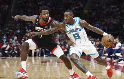 Jan 18, 2023; Houston, Texas, USA;  Charlotte Hornets guard Terry Rozier (3) controls the ball as Houston Rockets forward Tari Eason (17) defends during the third quarter at Toyota Center. Mandatory Credit: Troy Taormina-USA TODAY Sports