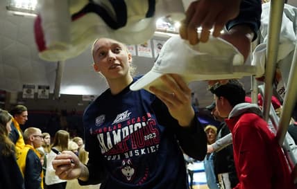 Feb 27, 2023; Storrs, Connecticut, USA; UConn Huskies guard Paige Bueckers (5) signs autographs after her teammates defeated the Xavier Musketeers at Harry A. Gampel Pavilion. Mandatory Credit: David Butler II-USA TODAY Sports
