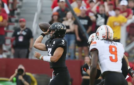 Iowa State Cyclones' quarterback Rocco Becht (3) passes the ball around Oklahoma State Cowboys' safety Trey Rucker (9)during the first quarter of an NCAA college football game at Jack Trice Stadium on Saturday, Sept. 23, 2023, in Ames, Iowa.