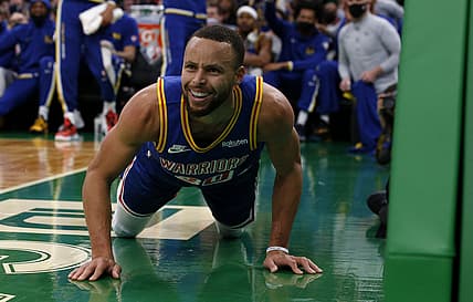 Dec 17, 2021; Boston, Massachusetts, USA; Golden State Warriors guard Stephen Curry (30) looks at a referee after being knocked down during the first quarter against the Boston Celtics at TD Garden. Mandatory Credit: Winslow Townson-USA TODAY Sports