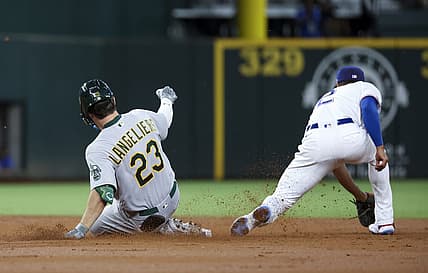 Aug 16, 2022; Arlington, Texas, USA;  Oakland Athletics catcher Shea Langeliers (23) hits a double for his first major league hit during the second inning against the Texas Rangers at Globe Life Field. Mandatory Credit: Kevin Jairaj-USA TODAY Sports