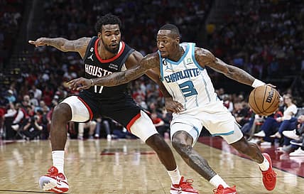 Jan 18, 2023; Houston, Texas, USA;  Charlotte Hornets guard Terry Rozier (3) controls the ball as Houston Rockets forward Tari Eason (17) defends during the third quarter at Toyota Center. Mandatory Credit: Troy Taormina-USA TODAY Sports