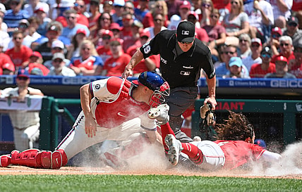Aug 15, 2021; Philadelphia, Pennsylvania, USA; Cincinnati Reds third baseman Jonathan India (6) slides safely into home ahead of throw to Philadelphia Phillies catcher J.T. Realmuto (left) during the third inning at Citizens Bank Park. Mandatory Credit: Eric Hartline-USA TODAY Sports
