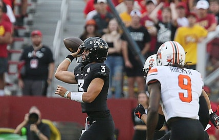 Iowa State Cyclones' quarterback Rocco Becht (3) passes the ball around Oklahoma State Cowboys' safety Trey Rucker (9)during the first quarter of an NCAA college football game at Jack Trice Stadium on Saturday, Sept. 23, 2023, in Ames, Iowa.
