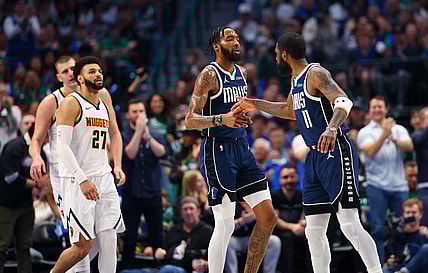 Mar 17, 2024; Dallas, Texas, USA;  Dallas Mavericks forward Derrick Jones Jr. (55) celebrates with Dallas Mavericks guard Kyrie Irving (11) in front of Denver Nuggets guard Jamal Murray (27) during the first quarter at American Airlines Center. Mandatory Credit: Kevin Jairaj-USA TODAY Sports