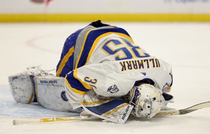 Feb 25, 2021; Buffalo, New York, USA; Buffalo Sabres goaltender Linus Ullmark (35) gets hurt during the first period against the New Jersey Devils at KeyBank Center. Mandatory Credit: Timothy T. Ludwig-USA TODAY Sports