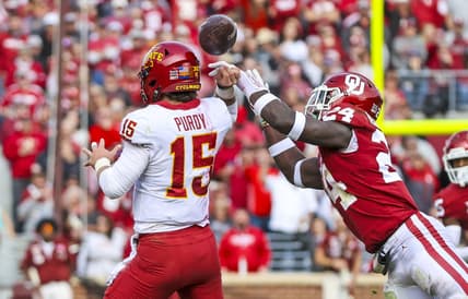 Nov 20, 2021; Norman, Oklahoma, USA;  Oklahoma Sooners linebacker Brian Asamoah (24) causes Iowa State Cyclones quarterback Brock Purdy (15) to fumble during the second quarter at Gaylord Family-Oklahoma Memorial Stadium. Mandatory Credit: Kevin Jairaj-USA TODAY Sports