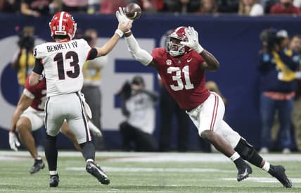 Dec 4, 2021; Atlanta, GA, USA; Georgia Bulldogs quarterback Stetson Bennett (13) throws a pass against Alabama Crimson Tide linebacker Will Anderson Jr. (31) during the SEC championship game at Mercedes-Benz Stadium. Alabama won 41-24. Mandatory Credit: Gary Cosby Jr.-USA TODAY Sports