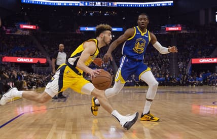 Jan 20, 2022; San Francisco, California, USA; Indiana Pacers guard Chris Duarte (3) attempts to drive past Golden State Warriors forward Jonathan Kuminga (00)  during the first quarter at Chase Center. Mandatory Credit: D. Ross Cameron-USA TODAY Sports