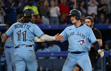 Sep 16, 2022; Toronto, Ontario, CAN;  Toronto Blue Jays third baseman Matt Chapman (26) is greeted by shortstop Bo Bichette (11) after hitting a two run home run against the Baltimore Orioles in the sixth inning at Rogers Centre. Mandatory Credit: Dan Hamilton-USA TODAY Sports