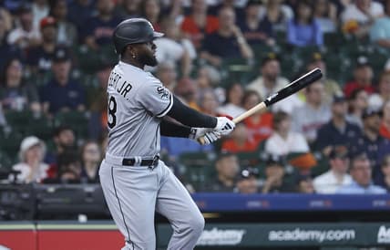 Apr 2, 2023; Houston, Texas, USA; Chicago White Sox center fielder Luis Robert Jr. (88) hits a double during the first inning against the Houston Astros at Minute Maid Park. Mandatory Credit: Troy Taormina-USA TODAY Sports