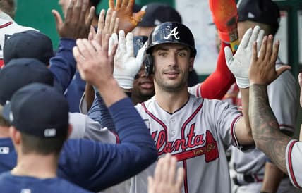 Apr 14, 2023; Kansas City, Missouri, USA; Atlanta Braves first baseman Matt Olson (28) is congratulated in the dugout after hitting a home run against the Kansas City Royals during the first inning at Kauffman Stadium. Mandatory Credit: Denny Medley-USA TODAY Sports