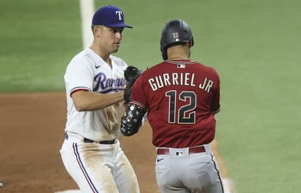 May 2, 2023; Arlington, Texas, USA; Texas Rangers first baseman Nathaniel Lowe (30) tags out Arizona Diamondbacks left fielder Lourdes Gurriel Jr. (12) during the fourth inning at Globe Life Field. Mandatory Credit: Kevin Jairaj-USA TODAY Sports