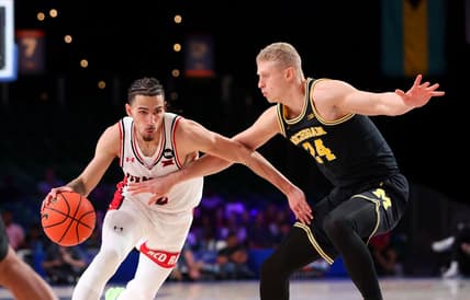 Nov 24, 2023; Paradise Island, BAHAMAS;  Texas Tech Red Raiders guard Pop Isaacs (2) drives to the basket as Michigan Wolverines forward Youssef Khayat (24) defends during the first half at Imperial Arena. Mandatory Credit: Kevin Jairaj-USA TODAY Sports