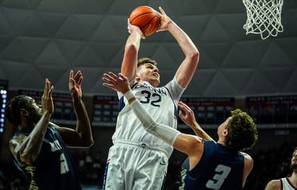 Nov 27, 2023; Storrs, Connecticut, USA; UConn Huskies center Donovan Clingan (32) shoots against New Hampshire Wildcats forward Jaxson Baker (3) in the first half at Harry A. Gampel Pavilion. Mandatory Credit: David Butler II-USA TODAY Sports