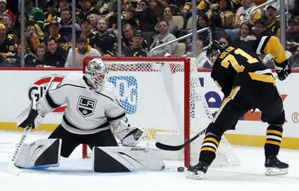 Feb 18, 2024; Pittsburgh, Pennsylvania, USA;  Los Angeles Kings goaltender Cam Talbot (39) makes a save against Pittsburgh Penguins center Evgeni Malkin (71) during the first period at PPG Paints Arena. Mandatory Credit: Charles LeClaire-USA TODAY Sports