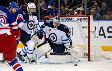 Mar 19, 2024; New York, New York, USA; Winnipeg Jets goalie Connor Hellebuyck (37) makes a save against the New York Rangers during the first period at Madison Square Garden. Mandatory Credit: Danny Wild-USA TODAY Sports
