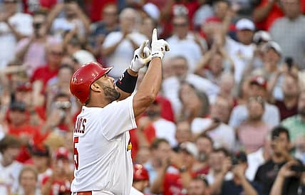 Jul 12, 2022; St. Louis, Missouri, USA;  St. Louis Cardinals designated hitter Albert Pujols (5) reacts after hitting a solo home run against the Los Angeles Dodgers during the second inning at Busch Stadium. Mandatory Credit: Jeff Curry-USA TODAY Sports