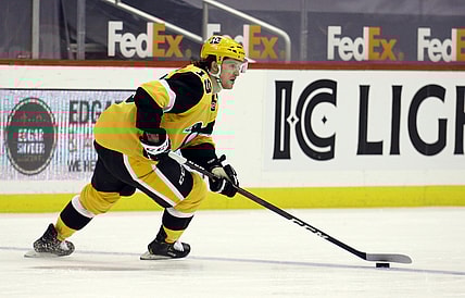 Apr 22, 2021; Pittsburgh, Pennsylvania, USA; Pittsburgh Penguins center Jared McCann (19) skates with the puck against the New Jersey Devils during the third period at PPG Paints Arena. Pittsburgh won 5-1. Mandatory Credit: Charles LeClaire-USA TODAY Sports