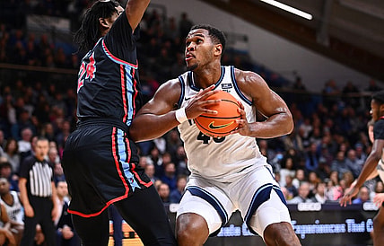 Nov 14, 2022; Villanova, Pennsylvania, USA; Villanova Wildcats forward Eric Dixon (43) drives against Delaware State Hornets center Raymond Somerville (24) in the second half at William B. Finneran Pavilion. Mandatory Credit: Kyle Ross-USA TODAY Sports