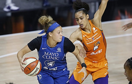 Sep 17, 2020; Palmetto, Florida, USA; Phoenix Mercury guard Skylar Diggins-Smith (right) guards against Minnesota Lynx guard Rachel Banham (15) during the second half at the FELD entertainment complex. Mandatory Credit: Reinhold Matay-USA TODAY Sports