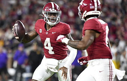 Nov 4, 2023; Tuscaloosa, Alabama, USA;  Alabama Crimson Tide quarterback Jalen Milroe (4) runs for a touchdown against LSU at Bryant-Denny Stadium. Alabama defeated LSU 42-28. Mandatory Credit: Gary Cosby Jr.-USA TODAY Sports