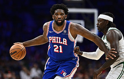 Nov 8, 2023; Philadelphia, Pennsylvania, USA; Philadelphia 76ers center Joel Embiid (21) drives against Boston Celtics guard Jrue Holiday (4) in the fourth quarter at Wells Fargo Center. Mandatory Credit: Kyle Ross-USA TODAY Sports