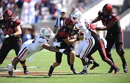 Sep 3, 2022; San Diego, California, USA; San Diego State Aztecs quarterback Braxton Burmeister (5) is tackled by Arizona Wildcats defensive lineman Tiaoalii Savea (98) during the second half at Snapdragon Stadium. Mandatory Credit: Orlando Ramirez-USA TODAY Sports