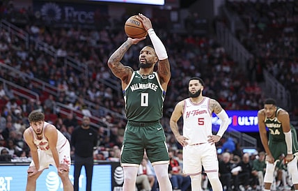 Jan 6, 2024; Houston, Texas, USA; Milwaukee Bucks guard Damian Lillard (0) attempts a free throw during the second quarter against the Houston Rockets at Toyota Center. Mandatory Credit: Troy Taormina-USA TODAY Sports