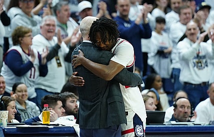 Mar 3, 2024; Storrs, Connecticut, USA; UConn Huskies head coach Dan Hurley hugs guard Tristen Newton (2) as he comes off the court during his final home game as they take on the Seton Hall Pirates at Harry A. Gampel Pavilion. Mandatory Credit: David Butler II-USA TODAY Sports