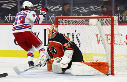 Mar 27, 2021; Philadelphia, Pennsylvania, USA; New York Rangers center Mika Zibanejad (93) scores a goal on Philadelphia Flyers goalie Brian Elliott (37) in the first period  at Wells Fargo Center. Mandatory Credit: Kyle Ross-USA TODAY Sports