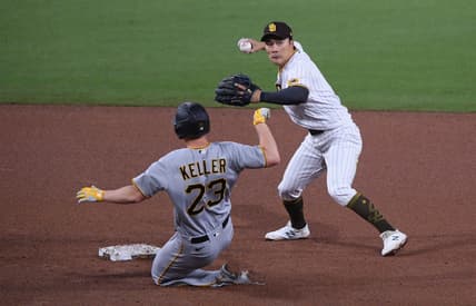 May 4, 2021; San Diego, California, USA; San Diego Padres shortstop Ha-seong Kim (R) throws to first base after forcing out Pittsburgh Pirates starting pitcher Mitch Keller (23) at second base during the fifth inning at Petco Park. Mandatory Credit: Orlando Ramirez-USA TODAY Sports