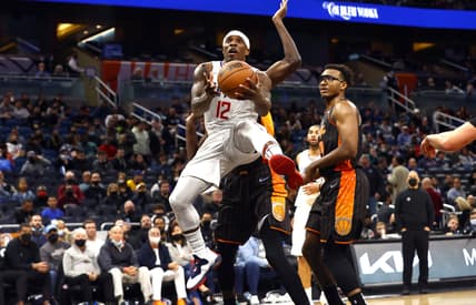 Jan 26, 2022; Orlando, Florida, USA; LA Clippers guard Eric Bledsoe (12) shoots a layup against the Orlando Magic during the second half at Amway Center. Mandatory Credit: Kim Klement-USA TODAY Sports